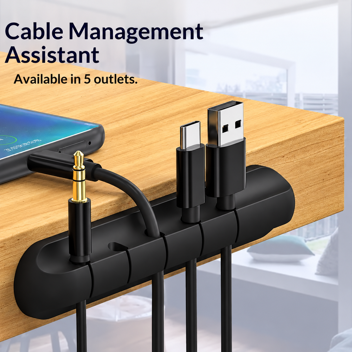 Black five-slot cable organizer holding cables along a wooden desk