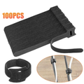 100-pack of black reusable hook-and-loop cable ties with example cable bundles